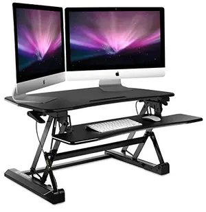 Mount-It 35.5-inch desk riser with keyboard tray in black, holding two monitors
