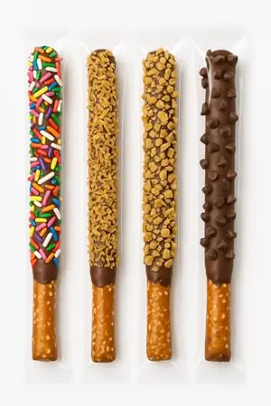 Individually wrapped chocolate dipped pretzel rods with sprinkles, toffee, coconut, and chocolate chips