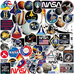 GRAPHICS & MORE NASA missions sticker pack with space shuttle, planets, and mission patches on a notebook