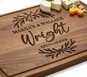 Tayfus personalized wood cutting board with deep laser engraving on a kitchen counter