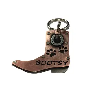 Handcrafted copper and nickel silver cowboy boot with horseshoe dog tag