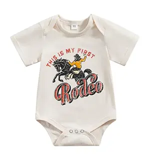 Apricot-colored baby bodysuit with 'Actually This Is My First Rodeo' text