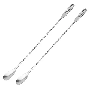 Two Cuttte bar spoons with trident fork tip on a countertop