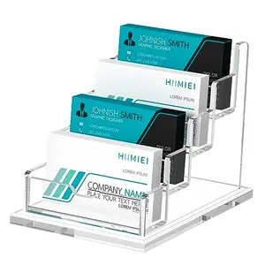 Four-tier acrylic card holder displaying colorful business cards in a stepped arrangement