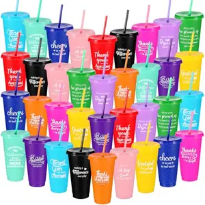 Pile of colorful Skylety tumblers with inspirational messages