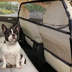 Snagle Paw dog car barrier installed in SUV cargo area, showing see-through mesh and sturdy frame