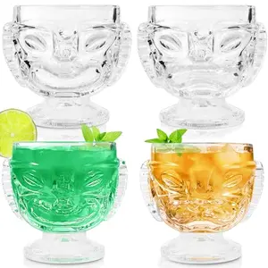 Set of 4 clear glass tiki mugs with happy and angry face sculpting, holding 17 ounces, perfect for showcasing layered rum cocktails.