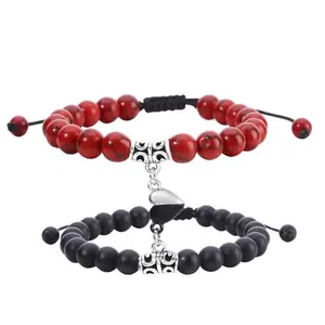 Turquoise and black magnetic heart couple bracelets on a white background
