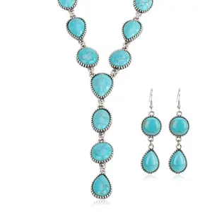 Y-shaped pendant necklace with matching drop earrings featuring turquoise accents