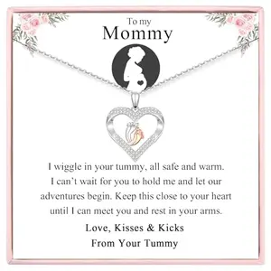 Sparkling heart necklace with tiny feet pendant