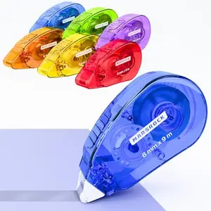 Six colorful double-sided adhesive tape rollers from Marsrock on a craft table.
