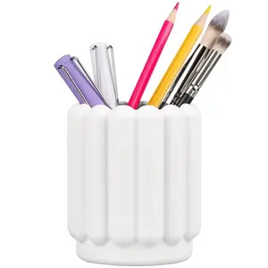 White silicone pencil cup on a kids desk