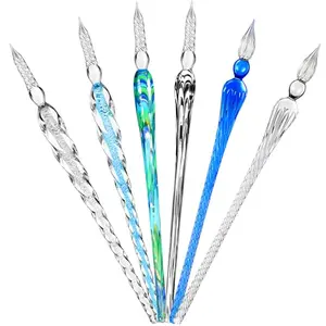 Set of six colorful glass dip pens on a white background