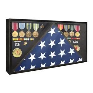 Black wooden flag shadow box with tempered glass front, displaying a folded burial flag and medals against velvet lining.