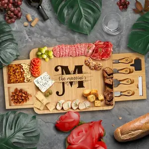 Bambusi rectangular personalized charcuterie board with natural bamboo finish and serving utensils