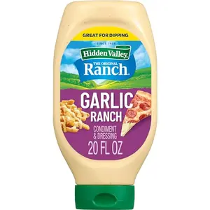 Hidden Valley Garlic Ranch squeeze bottle next to a pile of chicken wings