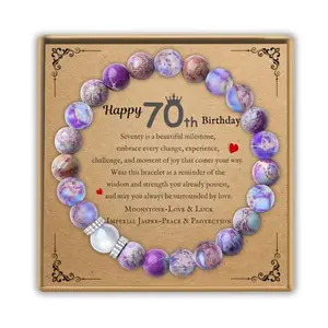 Moonstone and jasper bead bracelet with a humorous 70th birthday card beside it