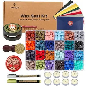 TRINIDa wax seal kit with 24 colors of beads, warmer, stamp, and accessories on a wooden table