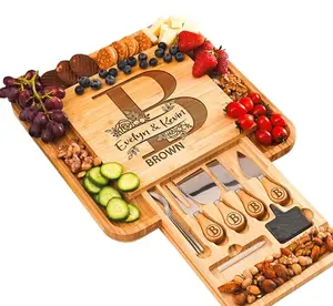 Square personalized charcuterie board with knife and fork drawer, slate labels, and chalk markers