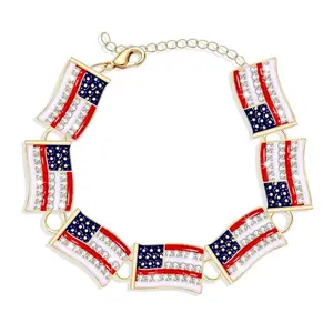 HEIDKRUEGER bracelet with multiple small enamel American flag charms on an adjustable chain