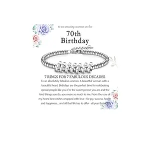 Silver-tone bracelet with seven interlocking circle charms on a beaded chain