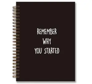 White spiral notebook with inspirational quote cover and lock wire binding