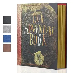 Large adventure book magnetic photo album open showing photos stuck on pages with 'Our Adventure Book' cover