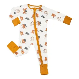 LollyBanks baby boy wearing cowboy print pajamas with fold-over cuffs