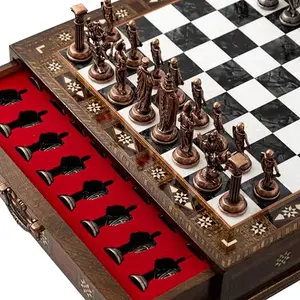 Luxury handmade wooden chess set with detailed British Army metal pieces on walnut board
