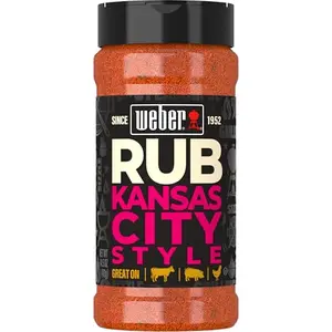 Weber KC BBQ Dry Rub container with a savory rack of ribs in background