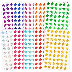 Holographic star stickers in 10 sparkling colors spread out on a table