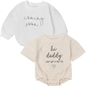 Two-pack baby onesie set with 'Hi Daddy I Can't Wait To Meet You' text for announcement