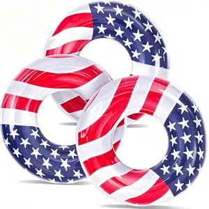 Three American flag swim tubes on pool water