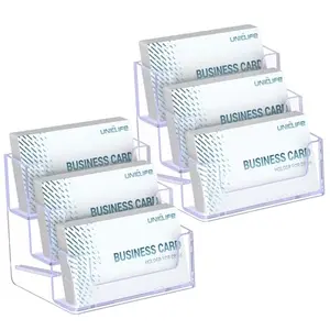 Clear acrylic business card holder with three slanted slots filled with colorful business cards