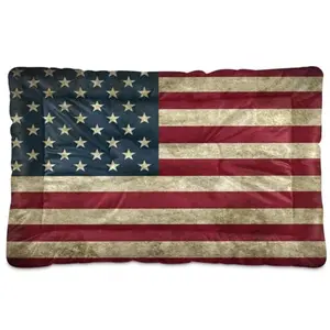 Full American flag dog bed mat with red, white, and blue design on a wooden floor