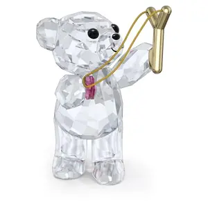 Swarovski Kris Bear figurine shooting a pink heart with a slingshot