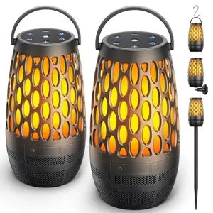 Two hesontec outdoor Bluetooth speakers with flame lights hanging from a tree