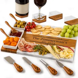 GIFTS TO ENGRAVE marble and wood personalized cheese board with stainless steel knife set on a rustic table