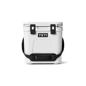 YETI Roadie 24 white hard cooler on a camping trip