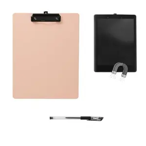 Pink BERHT magnetic clipboard with pen attached to a file cabinet