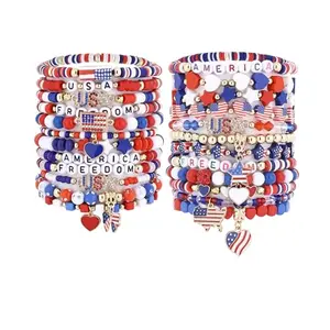 Collection of 24 handmade red, white, and blue clay bead bracelets with stars and letters