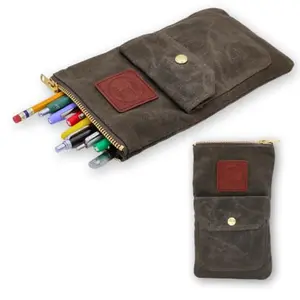Earth and fiber waxed canvas pouch with pens and pencils stored inside