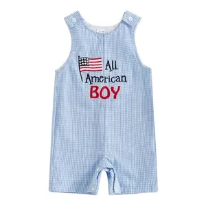 Baby boy and girl in adjustable strap overalls with American flag print