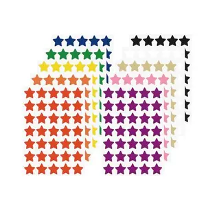 Vinyl star stickers in bright colors stuck on a water bottle and a laptop