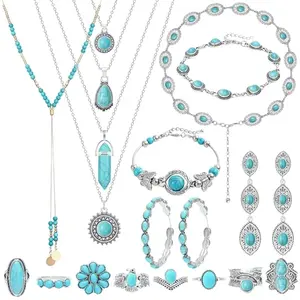 Collection of turquoise necklaces, bracelets, rings, and earrings displayed on a tray