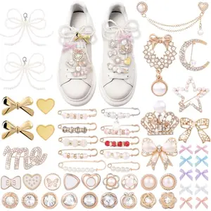 JOICEE pearl bow shoe charms on sneakers