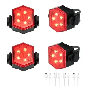 Hilngav 4 red tail lights attached to bike frame, helmet, and backpack