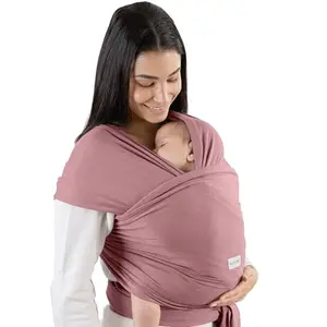 Comfy Cubs baby wrap carrier in mauve color with a parent wearing a toddler
