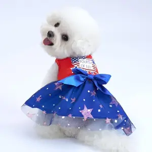 Small dog modeling XPUDAC red, white and blue tulle dress with cute bow for Independence Day celebration