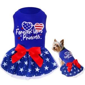 Small dog in blue phnydreg patriotic dress with sparkly stars and red bow, perfect for budget-conscious celebrations